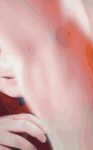 A Man Wearing Glasses And A Red Shirt Is Smiling GIF