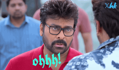 A Man Wearing Glasses And A Red Shirt Says Ohhhh GIF