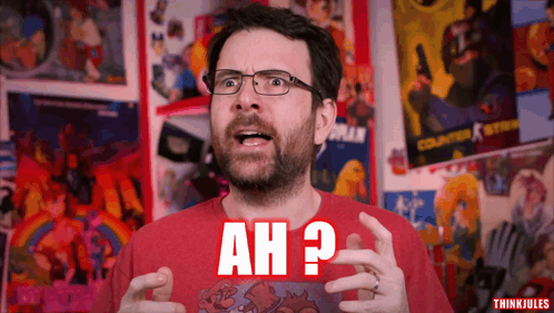 A Man Wearing Glasses And A Red Shirt With Ah Written On It GIF