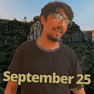 A Man Wearing Glasses And A September 25 Shirt GIF