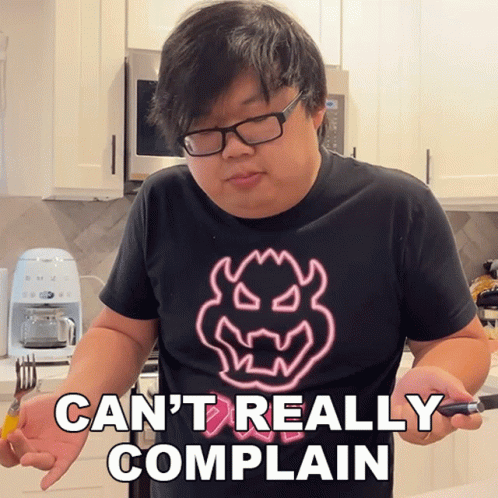 A Man Wearing Glasses And A Shirt That Says Can T Really Complain GIF