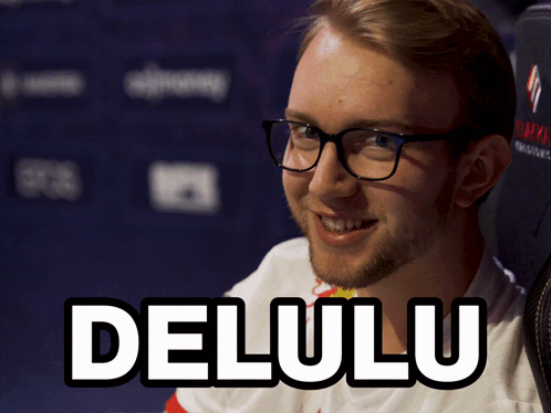 A Man Wearing Glasses And A Shirt That Says Delulu On It GIF