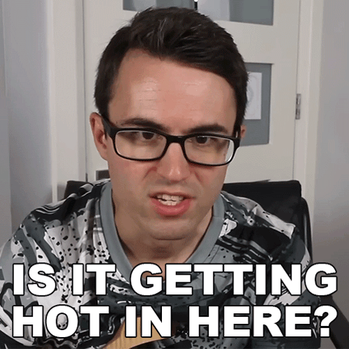 A Man Wearing Glasses And A Shirt That Says " Is It Getting Hot In Here " GIF