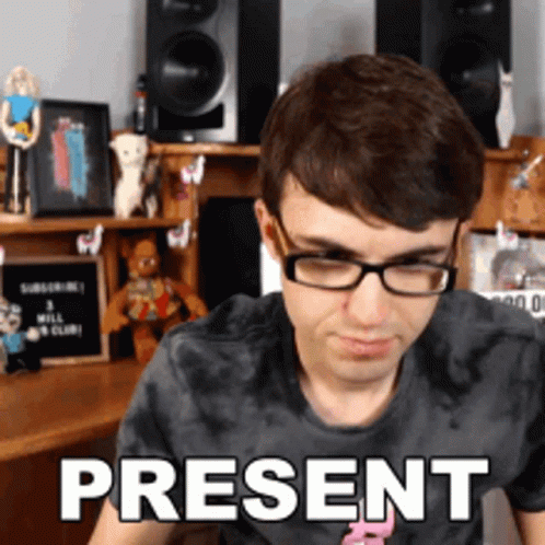 A Man Wearing Glasses And A Shirt That Says Present On It GIF