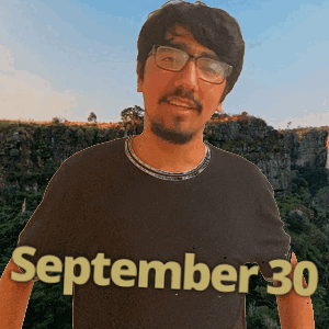 a man wearing glasses and a shirt that says september 30 on it
