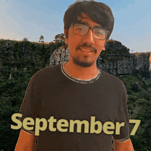 a man wearing glasses and a shirt that says september 7 on it