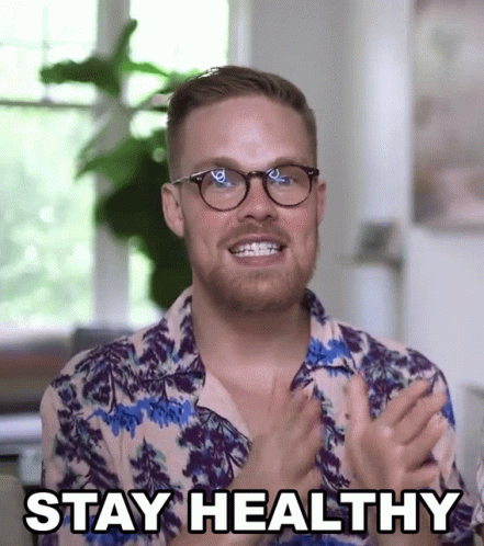 A Man Wearing Glasses And A Shirt That Says " Stay Healthy " GIF