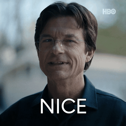 A Man Wearing Glasses And A Shirt With The Word Nice Written On His Face GIF