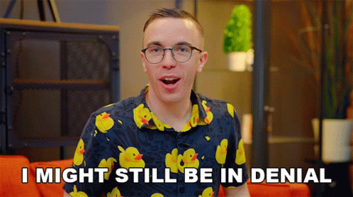 A Man Wearing Glasses And A Shirt With Yellow Ducks Says I Might Still Be In Denial GIF