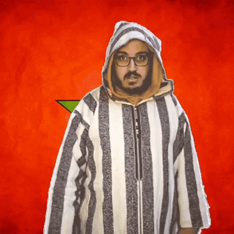 A Man Wearing Glasses And A Striped Jacket Has A Hood On GIF