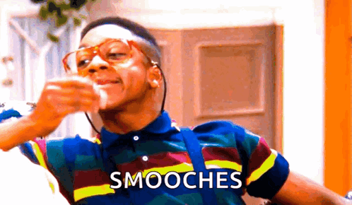Man In Striped Shirt Drinking With Smooches GIF