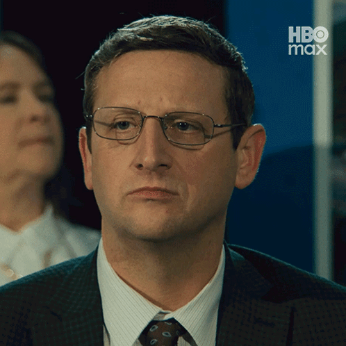 A Man Wearing Glasses And A Suit Has Hbo Max Written On The Bottom GIF