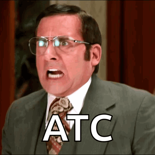 A Man Wearing Glasses And A Suit Has The Word Atc Written On His Face GIF