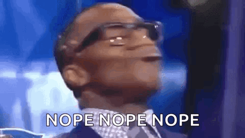 A Man Wearing Glasses And A Suit Is Making A Funny Face And Says Nope Nope Nope . GIF