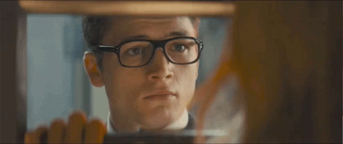 A Man Wearing Glasses And A Suit Says I 'Ll Be Right Back GIF