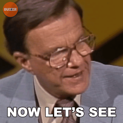 A Man Wearing Glasses And A Suit Says Now Let 'S See GIF
