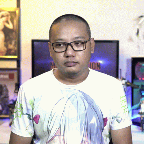 A Man Wearing Glasses And A T-Shirt With A Girl 'S Face On It GIF
