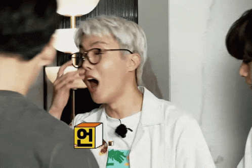 A Man Wearing Glasses And A T-Shirt With A Palm Tree On It Is Making A Funny Face GIF