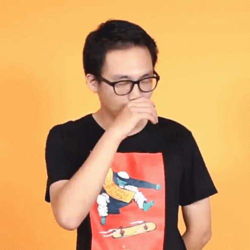 A Man Wearing Glasses And A T-Shirt With A Skateboard On It GIF