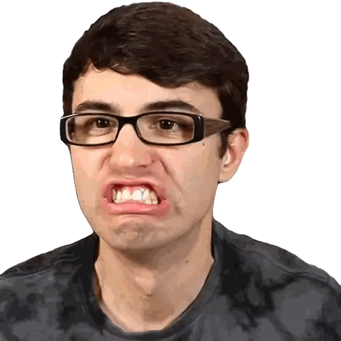 a man wearing glasses and a tie dye shirt makes an angry face