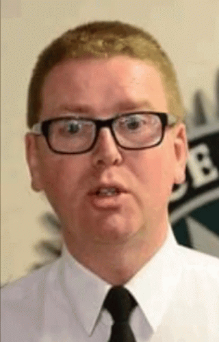 A Man Wearing Glasses And A Tie Is Talking GIF