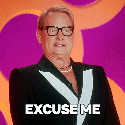 A Man Wearing Glasses And A Tuxedo Says Excuse Me GIF