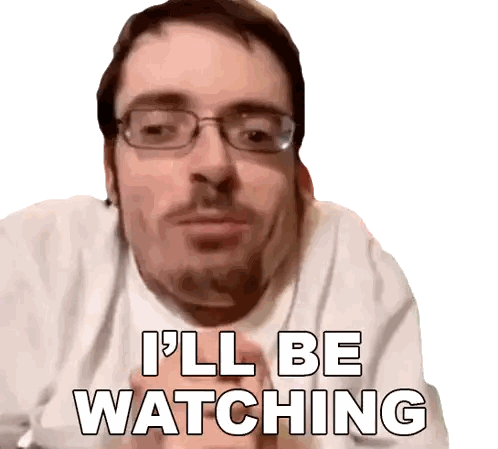 a man wearing glasses and a white shirt says i 'll be watching