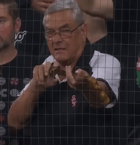 A Man Wearing Glasses And A White Sox Shirt GIF
