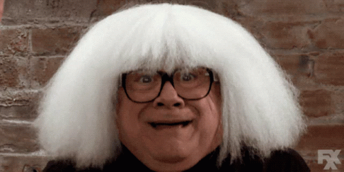A Man Wearing Glasses And A White Wig With Fx On The Bottom GIF