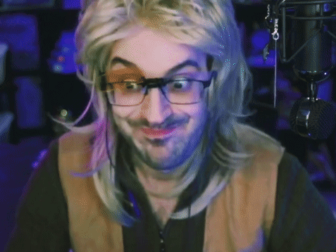 A Man Wearing Glasses And A Wig Is Giving A Thumbs Up Sign GIF