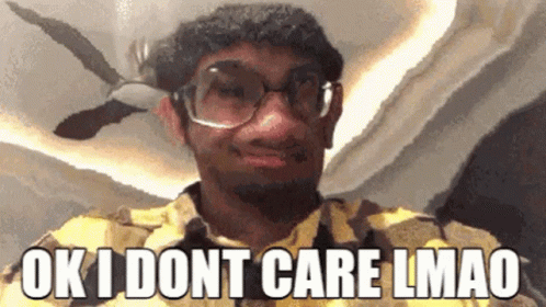 A Man Wearing Glasses And A Yellow Shirt Says Ok I Dont Care Lmao GIF