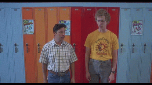 a man wearing glasses and a yellow shirt that says ' ricks college '