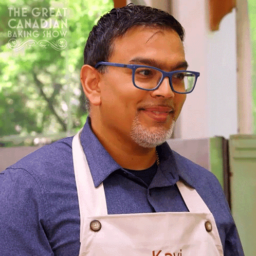Man Wearing Glasses And Apron With Baking Show Logo GIF