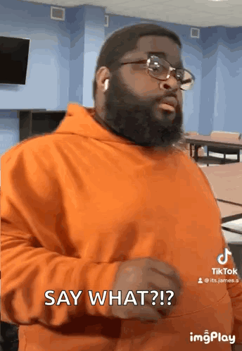 Man In Orange Hoodie Say What GIF