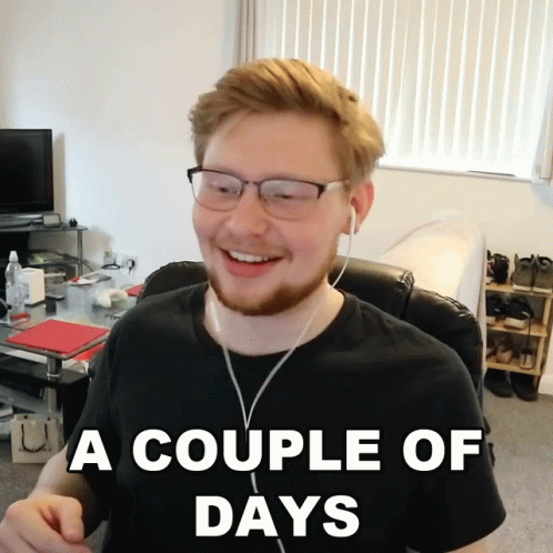 A Man Wearing Glasses And Ear Buds Is Smiling With The Caption A Couple Of Days GIF
