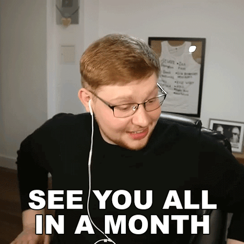 A Man Wearing Glasses And Earbuds Says See You All In A Month GIF