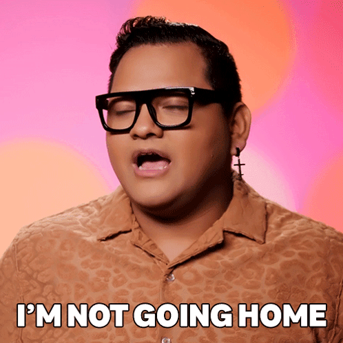 A Man Wearing Glasses And Earrings With The Words I 'M Not Going Home Below Him GIF