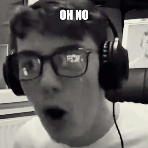 A Man Wearing Glasses And Headphones Has A Surprised Look On His Face And Says Oh No GIF