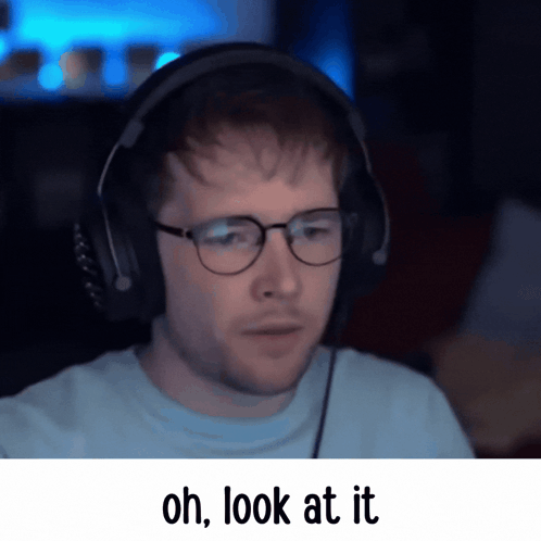 A Man Wearing Glasses And Headphones Has The Words Oh Look At It Below Him GIF
