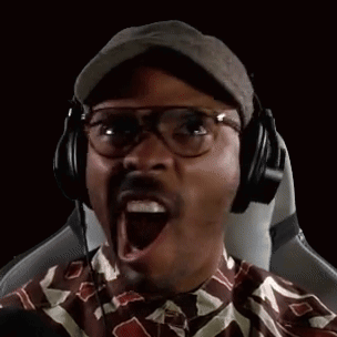 A Man Wearing Glasses And Headphones Is Making A Funny Face . GIF