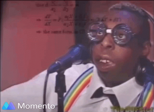A Man Wearing Glasses And Headphones Is Singing Into A Microphone And The Word Momento Is On The Bottom GIF