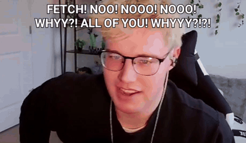 A Man Wearing Glasses And Headphones Is Sitting In A Chair And Talking To The Camera . GIF