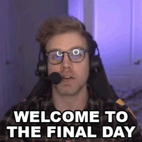 A Man Wearing Glasses And Headphones Is Sitting In A Chair With A Microphone In His Mouth . GIF