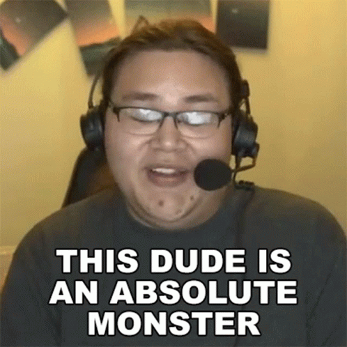 A Man Wearing Glasses And Headphones Is Talking Into A Microphone . GIF
