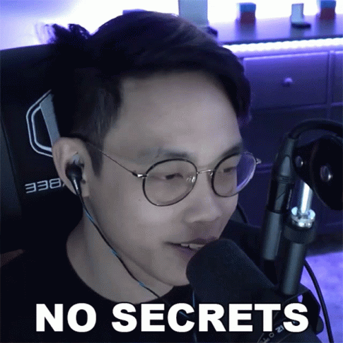 A Man Wearing Glasses And Headphones Is Talking Into A Microphone With The Words No Secrets Below Him GIF