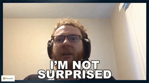 A Man Wearing Glasses And Headphones Says " I 'M Not Surprised " GIF