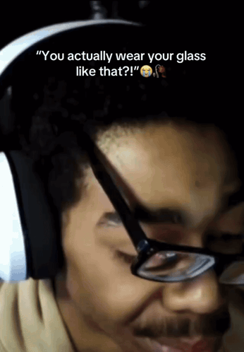 A Man Wearing Glasses And Headphones Says " You Actually Wear Your Glass Like That " GIF