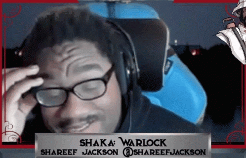 A Man Wearing Glasses And Headphones With The Name Shaka Warlock On The Bottom GIF