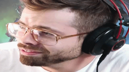 a man wearing glasses and headphones with the word akg on the bottom