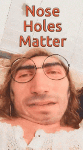 A Man Wearing Glasses Has The Words Nose Holes Matter Written Above Him GIF